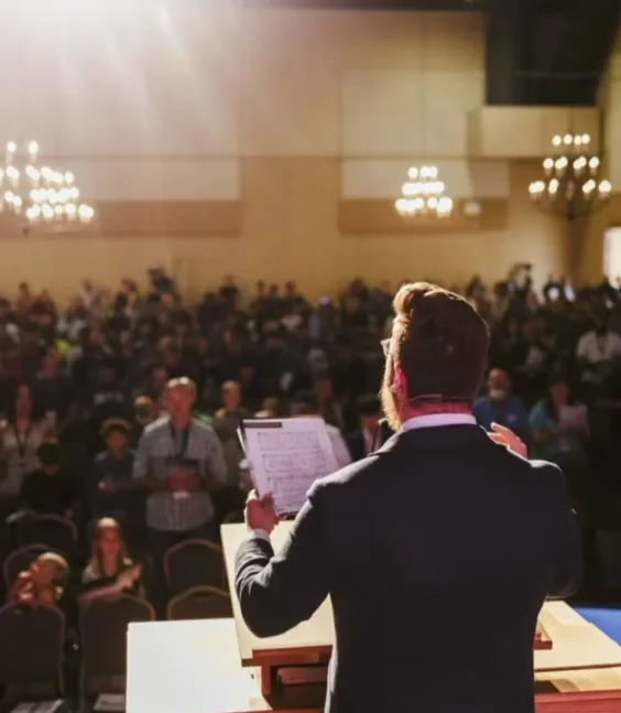 Sean leading singing at a performance